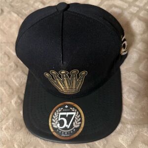 Luxury Black Cap with Gold Crown Design